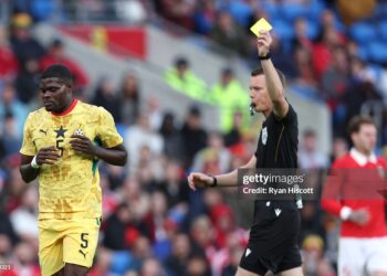 Thomas Partey of Ghana reacts after being booked by referee Oscar Johnson during the international friendly match between Wales and Ghana (Photo by Ryan Hiscott/Getty Images)