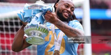 Antoine Semenyo of Manchester City celebrates with the trophy during the Emirates FA Cup Final match between Chelsea and Manchester City (Photo by Marc Atkins/Getty Images)