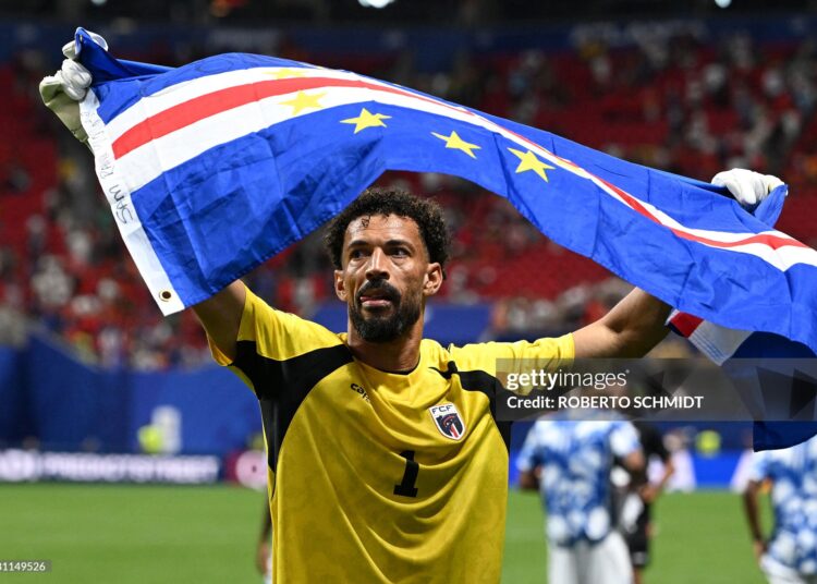 Cape Verde's goalkeeper #01 Vozinha celebrates with his national flag at the end of the 2026 World Cup Group H football match between Spain and Cape Verde (Photo by ROBERTO SCHMIDT / AFP via Getty Images)