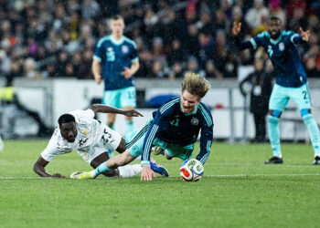 STUTTGART, GERMANY - MARCH 30: Derrick Luckassen of ghana challenges Nick Woltemade of Germany during the international friendly match between Germany and Ghana at MHP Arena on March 30, 2026 in Stuttgart, Germany. (Photo by Mika Volkmann/Getty Images)