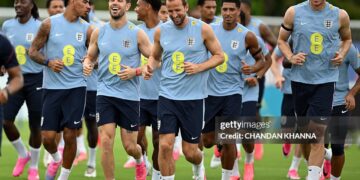 (LtoR) England's midfielder Morgan Rogers, England's midfielder Jordan Henderson, England's forward #09 Harry Kane, England's midfielder #10 Jude Bellingham and England's defender Dan Burn warm up during a training session as part of the team's preparation for its FIFA World Cup football tournament opening match against Croatia at the team's training camp in Palm Beach Gardens on June 9, 2026. (Photo by CHANDAN KHANNA / AFP via Getty Images)