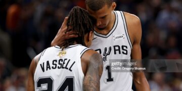 Devin Vassell #24 and Victor Wembanyama #1 of the San Antonio Spurs react during the fourth quarter against the New York Knicks in Game Five of the 2026 NBA Finals (Photo by Gregory Shamus/Getty Images)