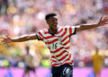 SEATTLE, WASHINGTON - JUNE 19: Alex Freeman #16 of the United States celebrates scoring his team's second goal during the FIFA World Cup 2026 Group D match between USA and Australia at Seattle Stadium on June 19, 2026 in Seattle, Washington. (Photo by Jared C. Tilton - FIFA/FIFA via Getty Images)