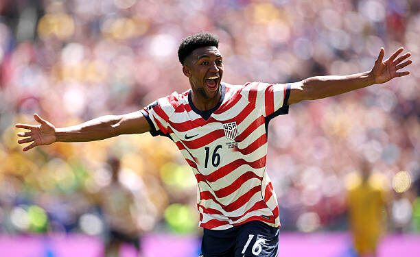 SEATTLE, WASHINGTON - JUNE 19: Alex Freeman #16 of the United States celebrates scoring his team's second goal during the FIFA World Cup 2026 Group D match between USA and Australia at Seattle Stadium on June 19, 2026 in Seattle, Washington. (Photo by Jared C. Tilton - FIFA/FIFA via Getty Images)