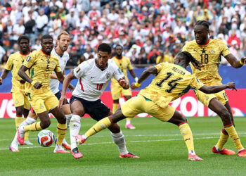 FOXBOROUGH, MASSACHUSETTS - JUNE 23: Jude Bellingham #10 of England is challenged by Gideon Mensah #14 of Ghana during the FIFA World Cup 2026 Group L match between England and Ghana at Boston Stadium on June 23, 2026 in Foxborough, Massachusetts. (Photo by Eddie Keogh - The FA/The FA via Getty Images)