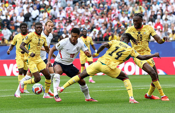 FOXBOROUGH, MASSACHUSETTS - JUNE 23: Jude Bellingham #10 of England is challenged by Gideon Mensah #14 of Ghana during the FIFA World Cup 2026 Group L match between England and Ghana at Boston Stadium on June 23, 2026 in Foxborough, Massachusetts. (Photo by Eddie Keogh - The FA/The FA via Getty Images)