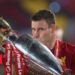 James Milner of Liverpool kisses the trophy to celebrate winning the League Title during the presentation ceremony of  the Premier League match between Liverpool FC and Chelsea FC at Anfield on July 22, 2020 in Liverpool, England. Football Stadiums around Europe remain empty due to the Coronavirus Pandemic as Government social distancing laws prohibit fans inside venues resulting in games being played behind closed doors. (Photo by Laurence Griffiths/Getty Images)