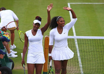 Venus and Serena Williams of The United States celebrates victory during the Ladies Doubles first round match against Andreja Klepac of Slovakia and Katarina Srebotnik of Slovakia on day four of the Wimbledon Lawn Tennis Championships at the All England Lawn Tennis and Croquet Club on June 30, 2016 in London, England.  (Photo by Jordan Mansfield/Getty Images)