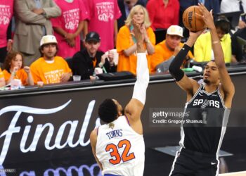 Victor Wembanyama #1 of the San Antonio Spurs shoots the ball against Karl-Anthony Towns #32 of the New York Knicks during the first quarter in Game One of the 2026 NBA Finals at Frost Bank Center on June 03, 2026 (Photo by Gregory Shamus/Getty Images)