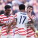 Malik Tillman #17 of the United States celebrates with team mates Alex Freeman #16 and Christian Pulisic #10 after scoring his team's second goal during the FIFA World Cup 2026 Round of 32 match between USA and Bosnia and Herzegovina (Photo by Alex Pantling - FIFA/FIFA via Getty Images)