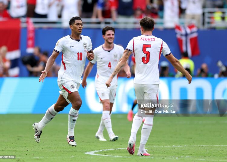 Jude Bellingham #10 of England celebrates with John Stones #5 after scoring his team's first goal during the FIFA World Cup 2026 Quarter Final match between Norway and England (Photo by Dan Mullan/Getty Images)