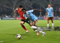 Jesse Bisiwu of Belgium runs with the ball whilst under pressure from Martim Chelmik of Portugal during the FIFA Under-17 World Cup Round of 32 match between Portugal and Belgium (Photo by Chris Ricco - FIFA/FIFA via Getty Images)
