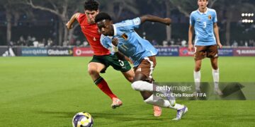 Jesse Bisiwu of Belgium runs with the ball whilst under pressure from Martim Chelmik of Portugal during the FIFA Under-17 World Cup Round of 32 match between Portugal and Belgium (Photo by Chris Ricco - FIFA/FIFA via Getty Images)