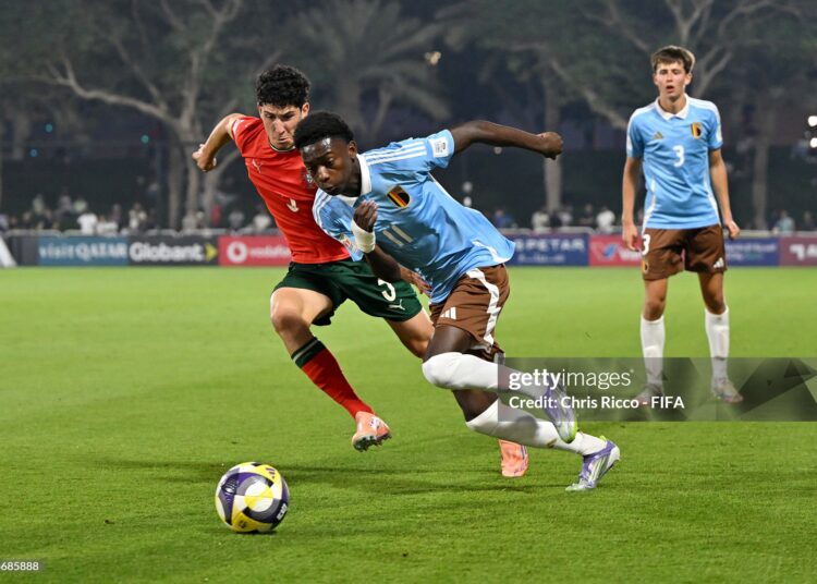 Jesse Bisiwu of Belgium runs with the ball whilst under pressure from Martim Chelmik of Portugal during the FIFA Under-17 World Cup Round of 32 match between Portugal and Belgium (Photo by Chris Ricco - FIFA/FIFA via Getty Images)