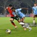 Jesse Bisiwu of Belgium runs with the ball whilst under pressure from Martim Chelmik of Portugal during the FIFA Under-17 World Cup Round of 32 match between Portugal and Belgium (Photo by Chris Ricco - FIFA/FIFA via Getty Images)