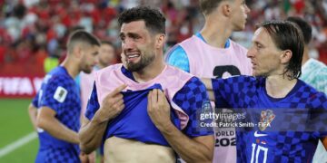 Mateo Kovacic #8 and Luka Modric #10 of Croatia react after the 1-2 loss during the FIFA World Cup 2026 Round of 32 match between Portugal and Croatia (Photo by Patrick Smith - FIFA/FIFA via Getty Images)