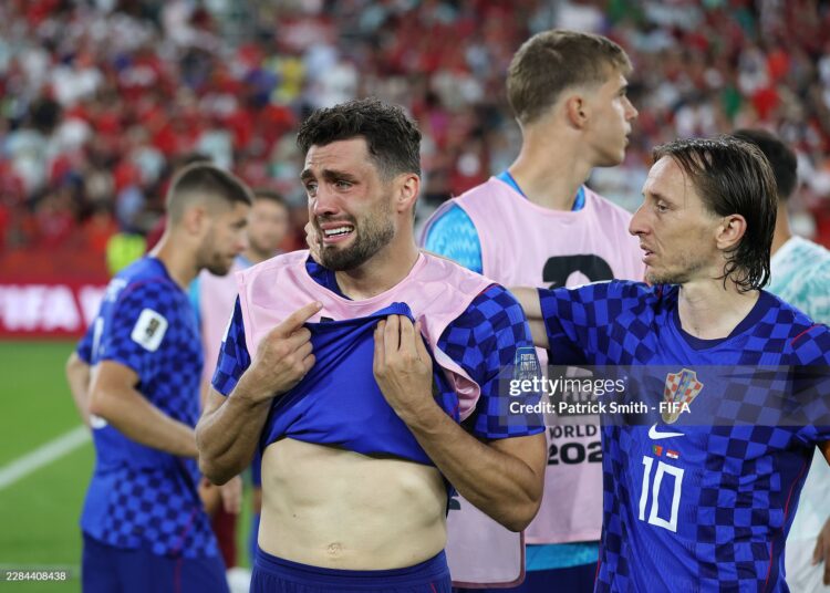 Mateo Kovacic #8 and Luka Modric #10 of Croatia react after the 1-2 loss during the FIFA World Cup 2026 Round of 32 match between Portugal and Croatia (Photo by Patrick Smith - FIFA/FIFA via Getty Images)