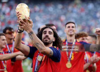 Marc Cucurella #24 of Spain celebrates with the FIFA World Cup Winner’s Trophy after the team’s victory following the FIFA World Cup 2026 Final match between Spain and Argentina (Photo by Carl Recine/Getty Images)