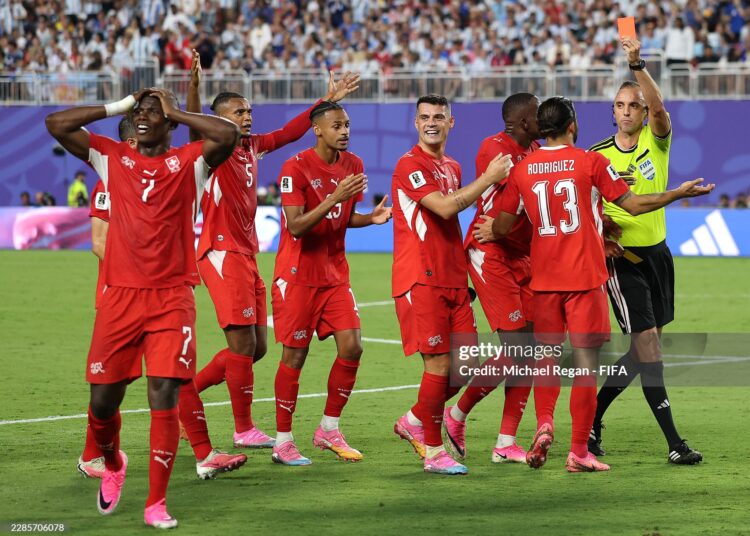 Referee Joao Pinheiro shows a red card to Breel Embolo #7 of Switzerland during the FIFA World Cup 2026 Quarter Final match between Argentina and Switzerland (Photo by Michael Regan - FIFA/FIFA via Getty Images)