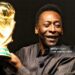 Brazilian football star Pele displays the FIFA World Cup during its presentation in Rio de Janeiro, Brazil on February 6, 2010. (Photo by Gabriel LOPES / AFP via Getty Images)