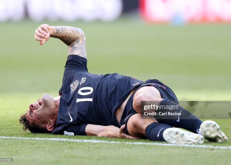 Christian Pulisic #10 of the United States reacts after challenged by Youri Tielemans #8 of Belgium during the FIFA World Cup 2026 Round of 16 match between USA and Belgium (Photo by Carl Recine/Getty Images)