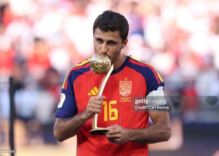 Rodri #16 of Spain is presented with the Golden Ball award after the FIFA World Cup 2026 Final match between Spain and Argentina (Photo by Carl Recine/Getty Images)