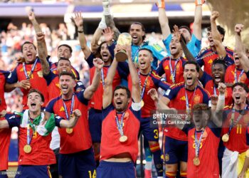 Rodri #16 of Spain lifts the FIFA World Cup Winner’s Trophy after the team’s victory following during the FIFA World Cup 2026 Final match between Spain and Argentina (Photo by Carl Recine/Getty Images)