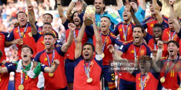 Rodri #16 of Spain lifts the FIFA World Cup Winner’s Trophy after the team’s victory following during the FIFA World Cup 2026 Final match between Spain and Argentina (Photo by Carl Recine/Getty Images)