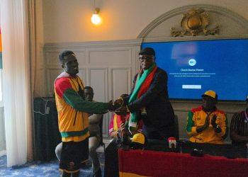 Minister for Sports and Recreation presenting the money to Abdul Wahid Omar