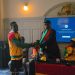 Minister for Sports and Recreation presenting the money to Abdul Wahid Omar