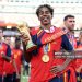Lamine Yamal #19 of Spain celebrates with the FIFA World Cup Winner’s Trophy after the team’s victory following the FIFA World Cup 2026 Final match between Spain and Argentina (Photo by Alex Pantling - FIFA/FIFA via Getty Images)