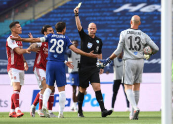Referee Anthony Taylor shows Cesar Azpilicueta of Chelsea the yellow card during the FA Cup Final match between Arsenal and Chelsea at Wembley Stadium on August 01, 2020 in London, England. Football Stadiums around Europe remain empty due to the Coronavirus Pandemic as Government social distancing laws prohibit fans inside venues resulting in all fixtures being played behind closed doors. (Photo by David Price/Arsenal FC via Getty Images)