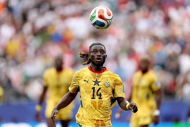 FOXBOROUGH, MASSACHUSETTS - JUNE 23: Gideon Mensah #14 of Ghana chases the ball during the FIFA World Cup 2026 Group L match between England and Ghana at Boston Stadium on June 23, 2026 in Foxborough, Massachusetts. (Photo by Patrick Smith - FIFA/FIFA via Getty Images)