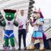 Swimmer Duncan Scott poses with mascots Clyde (left) and Finnie (right) on Bell's Bridge after his journey up the River Clyde in Glasgow for the official launch of the Scotland leg of the King's Baton Relay. The baton will travel from the Team Scotland camp in Glasgow to more than 50 events across the country, celebrating Scottish sport, culture, the Commonwealth and the Games. Picture date: Wednesday July 1, 2026. (Photo by Jane Barlow/PA Images via Getty Images)