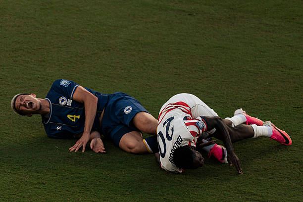 United States forward Folarin Balogun (20) and Bosnia and Herzegovina defender Tarik Muharemovic (4) are seen on the field after coming together during the second half of the FIFA World Cup 2026 Round of 32 Football match against Bosnia and Herzegovina in Santa Clara, Calif., Wednesday, July 1, 2026. Balogun was given a red card after a VAR review. (Photo by Stephen Lam/San Francisco Chronicle via Getty Images)