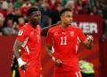 Breel Embolo #7 of Switzerland celebrates with Dan Ndoye #11 after scoring the team's first goal during the FIFA World Cup 2026 Round of 32 match between Switzerland and Algeria at BC Place Vancouver on July 02, 2026 in Vancouver, British Columbia. (Photo by Emilee Chinn/Getty Images)