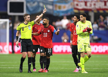 Mohamed Salah of Egypt protests as referee Francois Letexier shows the yellow card to Mostafa Shoubir of Egypt during the FIFA World Cup 2026 Round Of 16 match between Argentina and Egypt at Atlanta Stadium on July 7, 2026 in Atlanta, United States. (Photo by Charlotte Wilson/Offside/Offside via Getty Images)