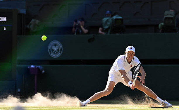 Italy's Jannik Sinner slips on the ground as he returns to Germany's Alexander Zverev during their men's singles final tennis match on the fourteenth day of the 2026 Wimbledon Championships at The All England Lawn Tennis and Croquet Club in Wimbledon, southwest London, on July 12, 2026. (Photo by Kirill KUDRYAVTSEV / AFP via Getty Images) / RESTRICTED TO EDITORIAL USE