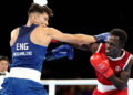 Patris Mughalzai of Team England and Abdul Wahib Omar of Team Ghana exchange punches during the Men's 65kg Round of 32 match on day one of the Glasgow 2026 Commonwealth Games at SEC Centre on July 24, 2026 in Glasgow, Scotland. (Photo by Lintao Zhang/Getty Images)