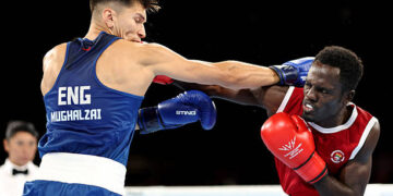 Patris Mughalzai of Team England and Abdul Wahib Omar of Team Ghana exchange punches during the Men's 65kg Round of 32 match on day one of the Glasgow 2026 Commonwealth Games at SEC Centre on July 24, 2026 in Glasgow, Scotland. (Photo by Lintao Zhang/Getty Images)