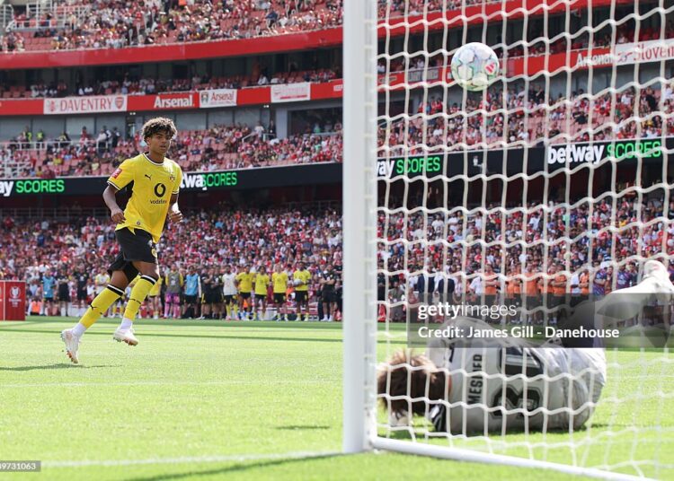 Mathis Albert of Borussia Dortmund has a penalty saved in the shootout by Illan Meslier of Arsenal during the pre-season friendly match between Arsenal FC and Borussia Dortmund at Emirates Stadium on August 09, 2026 in London, England. (Photo by James Gill - Danehouse/Getty Images)