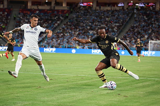 Inter Milan's midfielder Aleksandar Stankovic and Manchester City's midfielder Antoine Semenyo fight for the ball during the Asahi Super Dry Trophy football match between Manchester City and Inter Milan at Kai Tak Stadium in Hong Kong on August 1, 2026. (Photo by May JAMES / AFP via Getty Images)