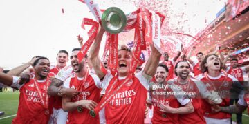 Martin Odegaard of Arsenal lifts the Premier League trophy during the Premier League match between Crystal Palace and Arsenal at Selhurst Park on May 24, 2026 in London, England. (Photo by Michael Regan/Getty Images For Premier League)