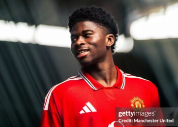 Carlos Baleba of Manchester United poses after signing for the club (Photo by Manchester United/Manchester United via Getty Images)