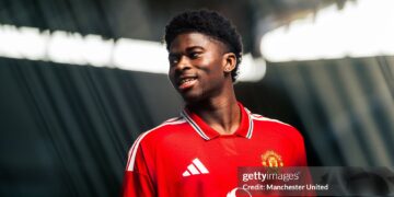 Carlos Baleba of Manchester United poses after signing for the club (Photo by Manchester United/Manchester United via Getty Images)