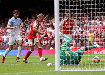 Martin Odegaard of Arsenal scores his team's third goal during the 2026 FA Community Shield match between Arsenal and Manchester City at Principality Stadium on August 16, 2026 in Cardiff, Wales. (Photo by Carl Recine/Getty Images)