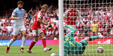 Martin Odegaard of Arsenal scores his team's third goal during the 2026 FA Community Shield match between Arsenal and Manchester City at Principality Stadium on August 16, 2026 in Cardiff, Wales. (Photo by Carl Recine/Getty Images)