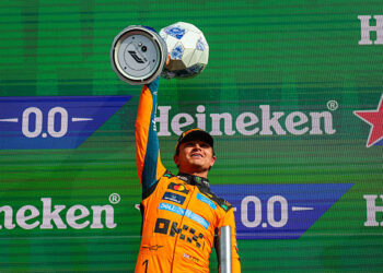 Lando Norris of Great Britain and McLaren Mastercard F1 Team raises his trophy in celebration on the podium during the F1 Grand Prix of Netherlands at Circuit Zandvoort on August 23, 2026 in Zandvoort, Netherlands. (Photo by Kym Illman/Getty Images)