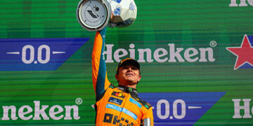 Lando Norris of Great Britain and McLaren Mastercard F1 Team raises his trophy in celebration on the podium during the F1 Grand Prix of Netherlands at Circuit Zandvoort on August 23, 2026 in Zandvoort, Netherlands. (Photo by Kym Illman/Getty Images)