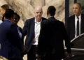 President Gianni Infantino (C) leaves Al-Madina Stadium in Rabat following the 2026 Women's Africa Cup of Nations match between Malawi and Zambia on August 5, 2026. Infantino, under fire for a now shelved plan to open the World Cup to private investment, earlier held emergency talks in Morocco with directors of the world football governing body.
FIFA then issued an apology while reaffirming its "full support" for Infantino. In a statement, the leadership acknowledged "that errors were also made after the proposal was leaked to media". (Photo by Abdelmajid BZIOUAT / AFP via Getty Images)